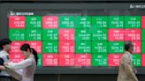 Stock market today: Asian shares mostly decline after Nasdaq ticks to a record high