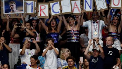 Marchand madness sweeps France as swimmer makes gold rush