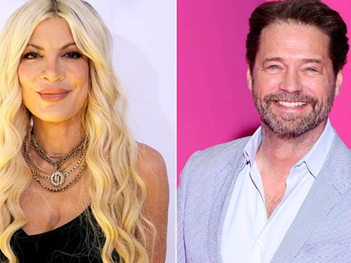 Tori Spelling says she chipped her front tooth during makeout session with Jason Priestley in an elevator