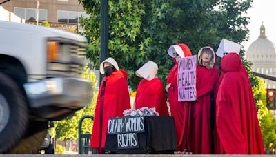 ‘Women are not free’: Idaho protesters rally in Boise with ‘Handmaid’s Tale’ costumes