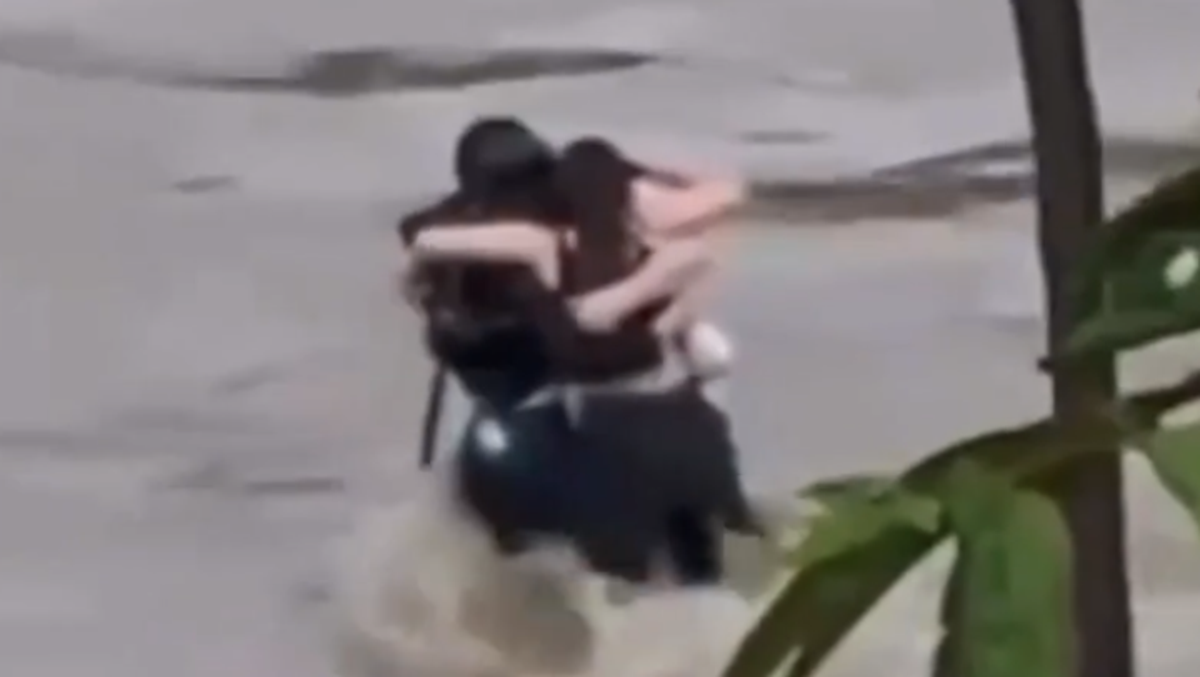 Italy floods: Heartbreaking footage of three friends hugging before being swept away