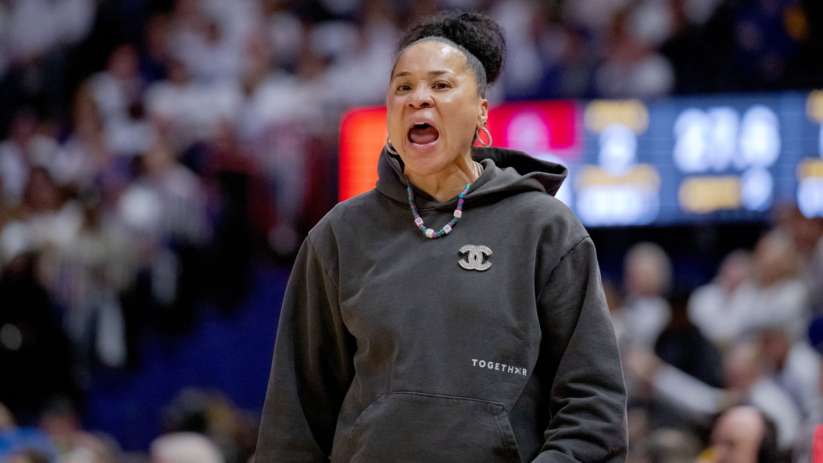 Dawn Staley attends Gucci fashion show in Milan, Italy, but still tweets about WNBA games