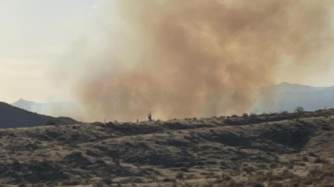 Adams Fire burning off State Route 87, officials say