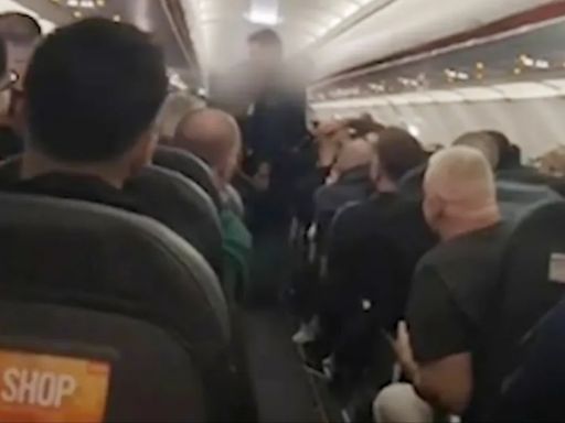 Glasgow easyJet passengers chant 'cheerio' as rowdy couple hauled off plane
