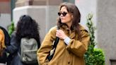 Katie Holmes’s Mustard Brown Trench Is the Perfect Coat for Waiting Out Summer