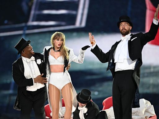 Travis Kelce makes surprise onstage appearance at Taylor Swift’s concert – and fans are freaking out