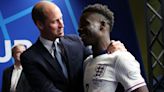 Jubilant Prince William hugs goal hero Bukayo Saka as England make semi-finals