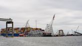 First cargo ship passes through newly opened channel in Baltimore since bridge collapse