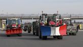 French farmers' unions suspend protests after government offer