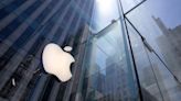 Apple iPhone sales plunge, as shares rise on dividend, stock buyback news