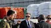 US Secretary of State Antony Blinken walks with Israeli Defence Minister Yoav Gallant and UN Senior Humanitarian and Reconstruction...