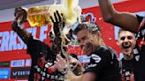 Xabi Alonso drenched in beer by players after Bayer Leverkusen wins first Bundesliga title