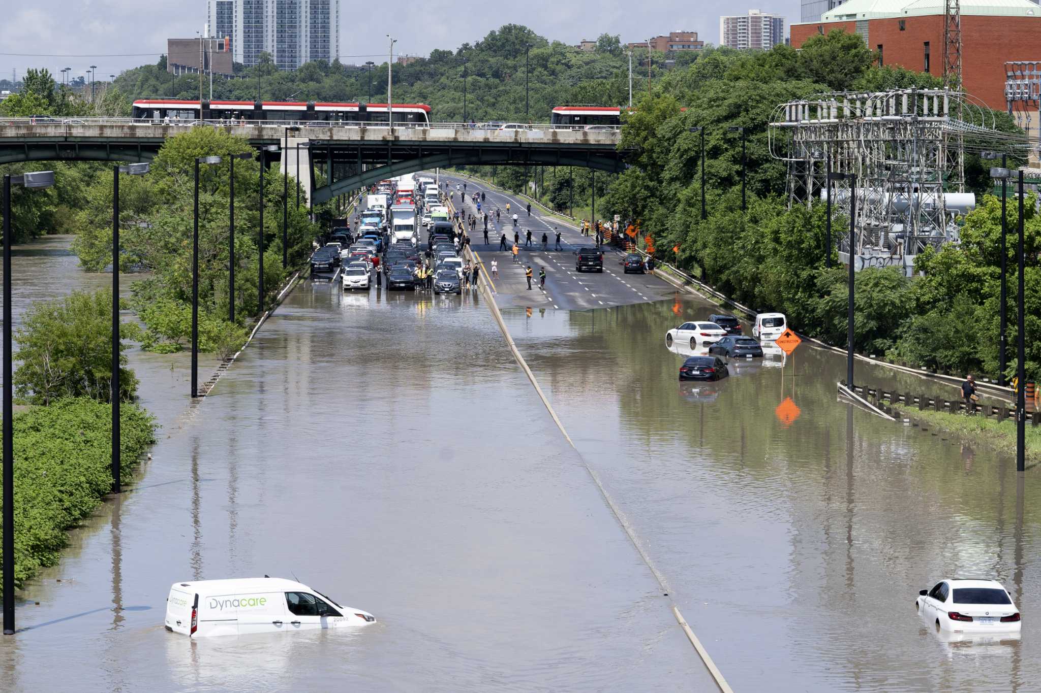 Storms flood the Ozarks and strand drivers in Toronto. A tornado moves a B-52 bomber in New York