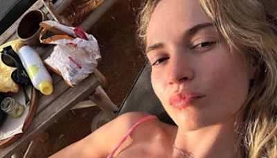 Lily James flaunts her incredible figure in a high cut-pink swimsuit