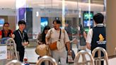 Relieved travellers land in Singapore after deadly turbulence