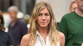 Jennifer Aniston kisses pup in ab-baring work-out photo inside home gym