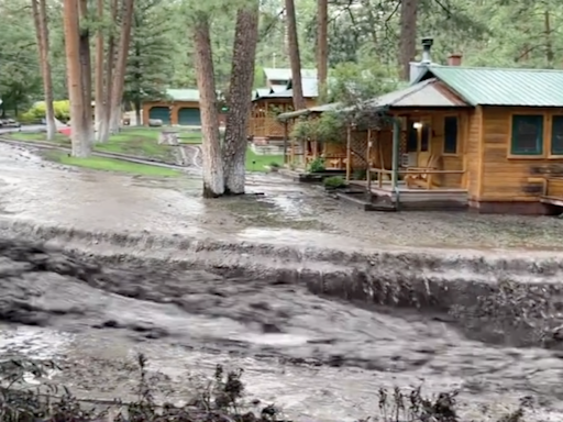 Woman trapped in tree, bridge destroyed, landspout in 'extreme' Ruidoso burn scar flooding