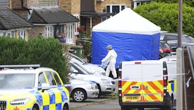 U.K. police search for man armed with crossbow after 3 women killed in home near London