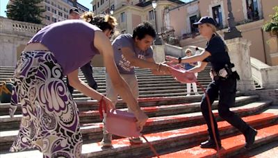 Activists pour paint down Rome’s Spanish Steps in outrage over femicide in Italy