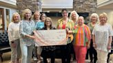 Woman’s Club presents donation to Local Library