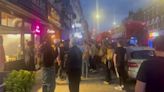 Crowd gathers outside London restaurant as three adults and child injured in shooting