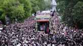 Thousands turn out as funeral procession begins for Iranian president