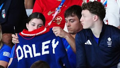 Olympic medalist Tom Daley unveils his latest achievement: A sweater, knitted poolside