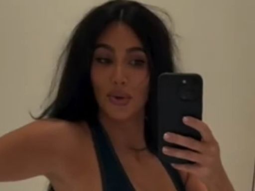 Kim Kardashian struggles to close bodysuit and enlists Khloe's help