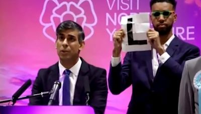 Rishi Sunak Lost Big. YouTuber Mocked Him With A Giant "L" Sign Behind Him