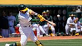 Athletics muscle up in first game of doubleheader to beat Rangers