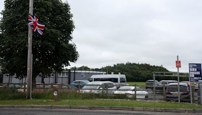 Flags erected at East Belfast GAA playing fields and integrated school during camogie session