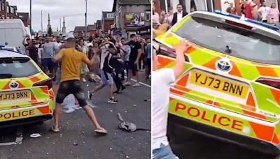 Chaos on streets of Leeds as angry rioting mob smashes up police cars