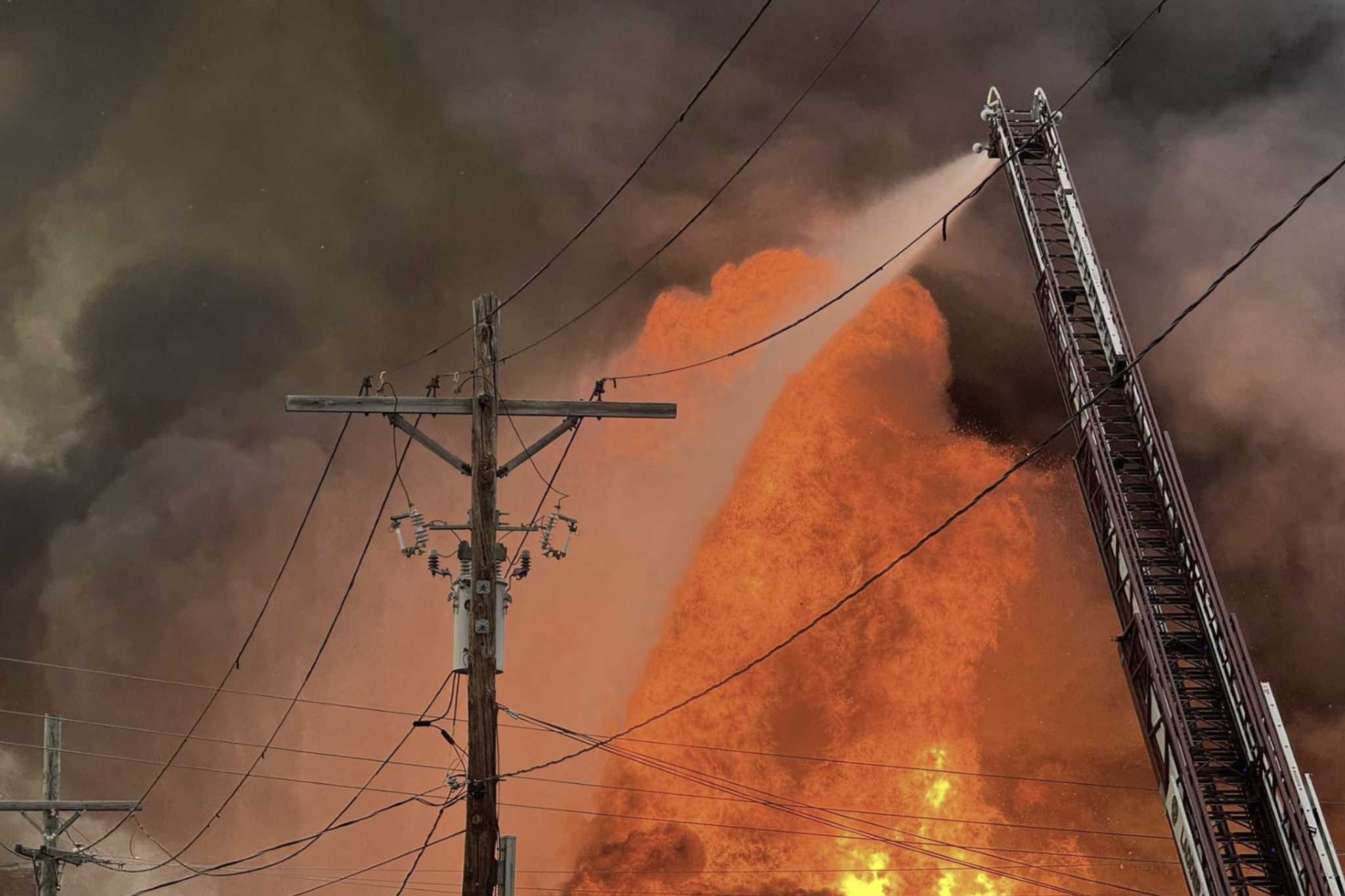 2 fire tanker trucks heading to large warehouse blaze crash, injuring 7 firefighters