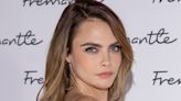 Cara Delevingne's new wet-look feather fringe adds a grunge touch to her bob
