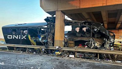 At least 10 killed after bus smashes into bridge pillar