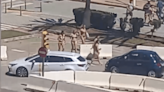 Moment near-NAKED tourists in bikinis are confronted by furious Majorca locals