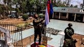 Rebels raise flag at seized Myanmar base, commander confident of retaining control