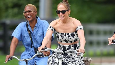 Jennifer Lopez laughs as she bicycles in a bra top in the Hamptons