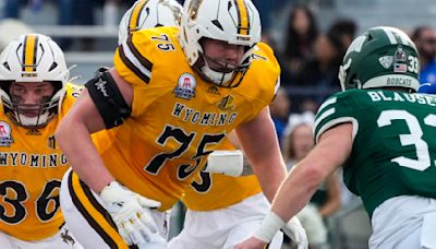 UW OT and Laramie High grad Frank Crum signs with Broncos