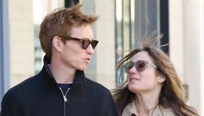 Eddie Redmayne puts on a loved-up display with wife Hannah Bagshawe as they saunter arm-in-arm around New York City where the actor is starring in the Broadway revival of Cabaret