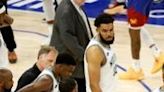 Minnesota's Anthony Edwards walks to the bench with training staff after a hard fall in the Timberwolves' victory over the Denver Nuggets in game six of their NBA Western Conference semifinal series