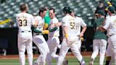 A's hit 2 tying homers in late innings and score 5 runs in 11th to rally past Rockies 10-9