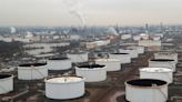 Oil settles near 7-week lows, focus shifts to economy