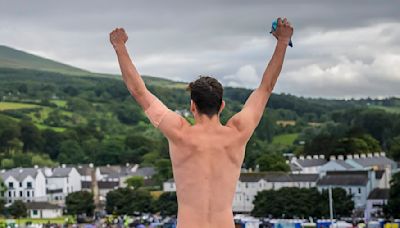 Daredevils jump from 88-foot board in the cliff diving world series