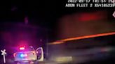 Harrowing moment train hits a parked Colorado police car with suspect inside