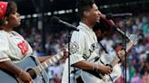 Jon Batiste performs at MLB tribute game