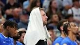 Dallas star Luka Doncic watches from the bench as the Mavs fall to the Boston Celtics in game three of the NBA Finals