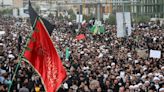 Mourners begin days of funerals for Iran's president and others killed in helicopter crash