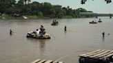 Families board makeshift rafts to get closer to the US