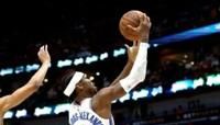 Shai Gilgeous-Alexander of the Oklahoma City Thunder shoots over CJ McCollum in the Thunder's victory over the New Orleans Pelicans in game three of...